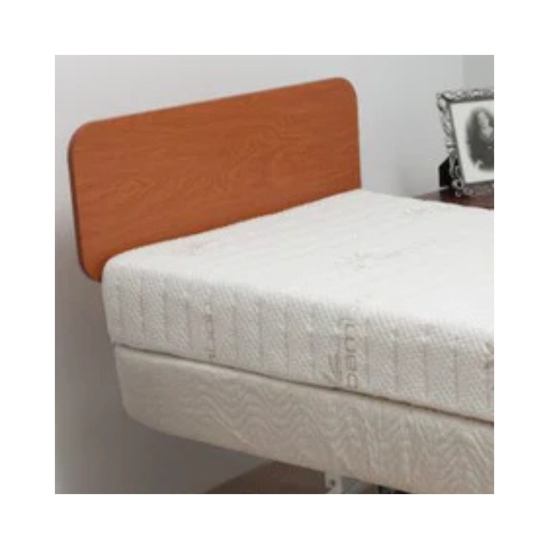 Transfer Master wooden footboard attached to hospital or adjustable bed with white mattress