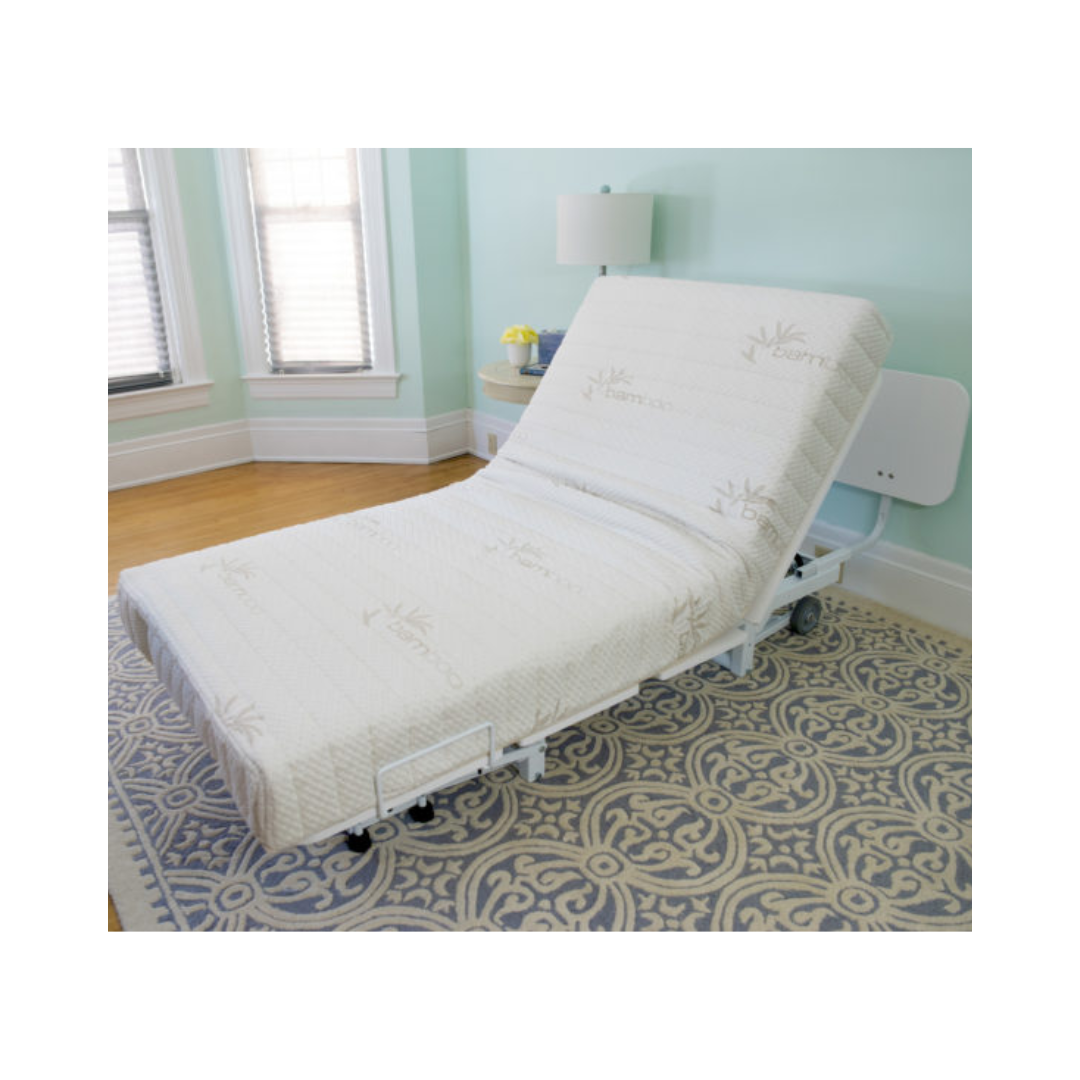 Transfer Master New Valiant Adjustable Hospital Bed with mattress in a bright room on patterned rug
