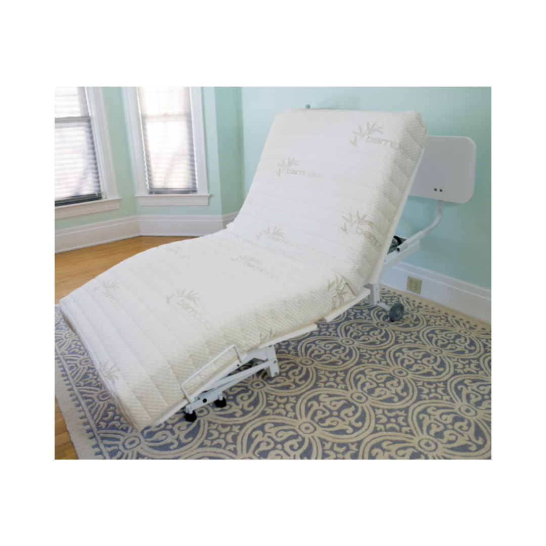 Transfer Master New Valiant Adjustable Hospital Bed with white mattress in a room with patterned carpet