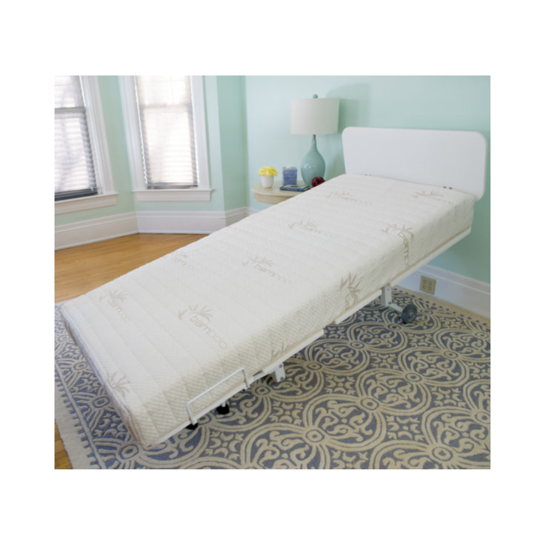 Transfer Master New Valiant Adjustable Hospital Bed with white frame and mattress in a bright room