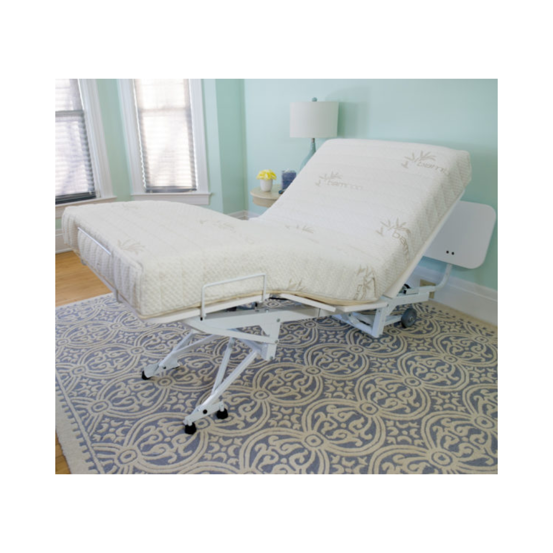 Transfer Master New Valiant Adjustable Hospital Bed with white mattress in a bright room